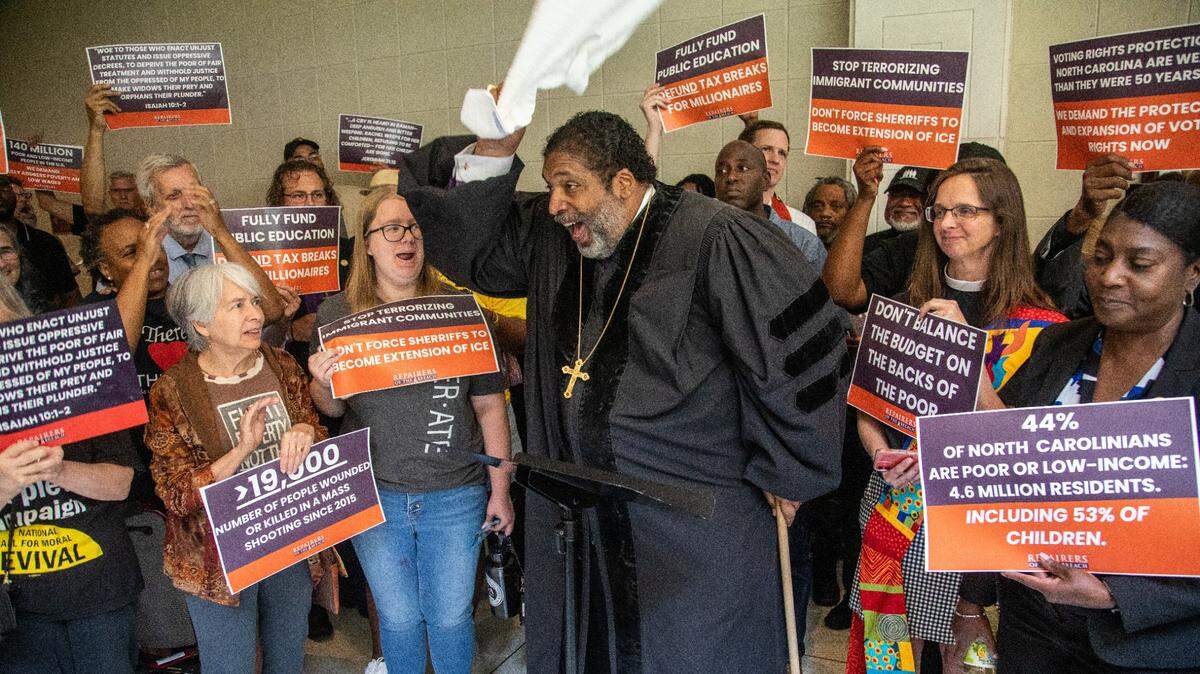 Rev. William Barber II leads a rally of more than 100 demonstrators between entrances to the House and Senate chambers at the Legislative Building in Raleigh, N.C. Wednesday, May 24, 2023. The protesters called for the Republican-led legislature to amend its budget proposals.