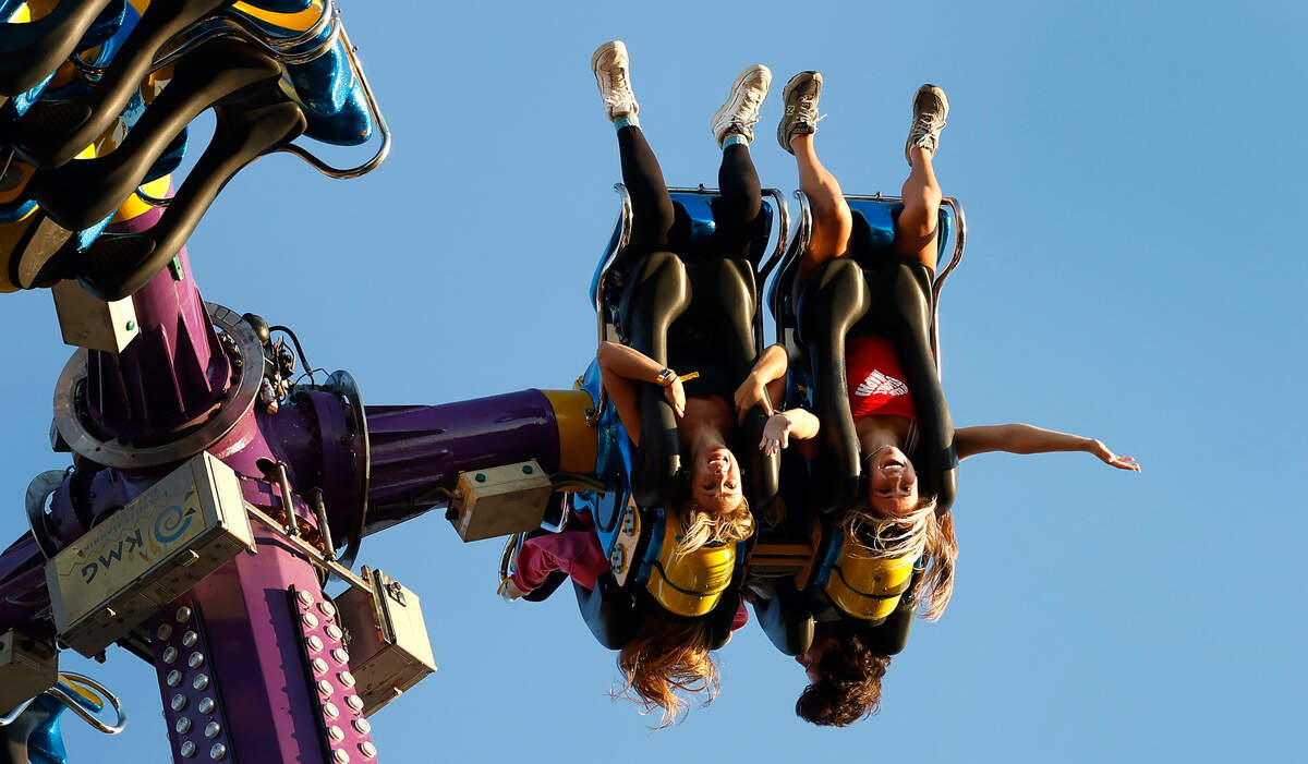 Addie Lowder, left, and her sister, Haynes, ride Khaos at the N.C. State Fair in Raleigh, N.C. The 2024 state fair runs Oct. 17-Oct. 27.