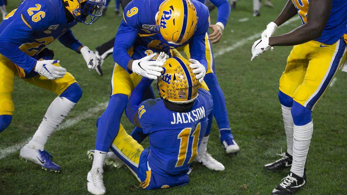 Pittsburgh’s Saleem Brightwell (9) embraces Dane Jackson (11) after stopping North Carolina on fourth down in overtime to secure a 34-27 overtime victory on Thursday, November 14, 2019 at Heinz Field in Pittsburgh, Pa.