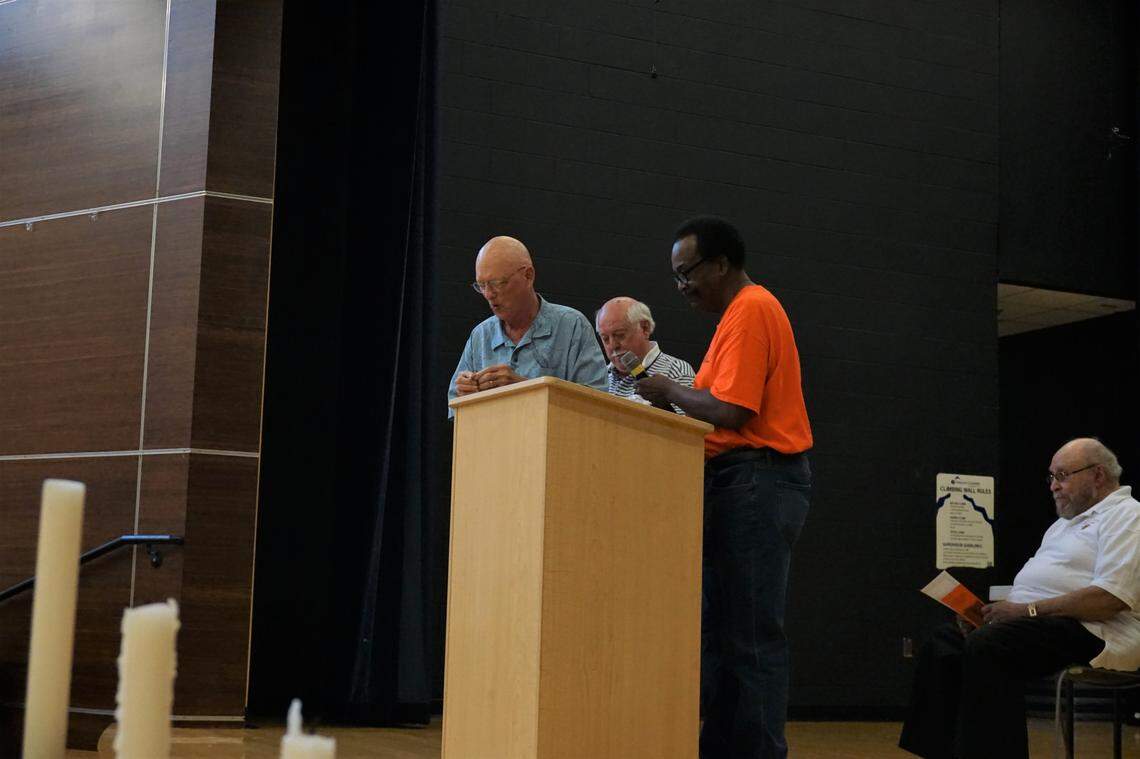 David Mason Jr., President of the Lincoln High School alumni association, presenting Jock Lauterer and Richard Ellington with honorary Lincoln Tigers pins, photographed on Monday Sept. 2.