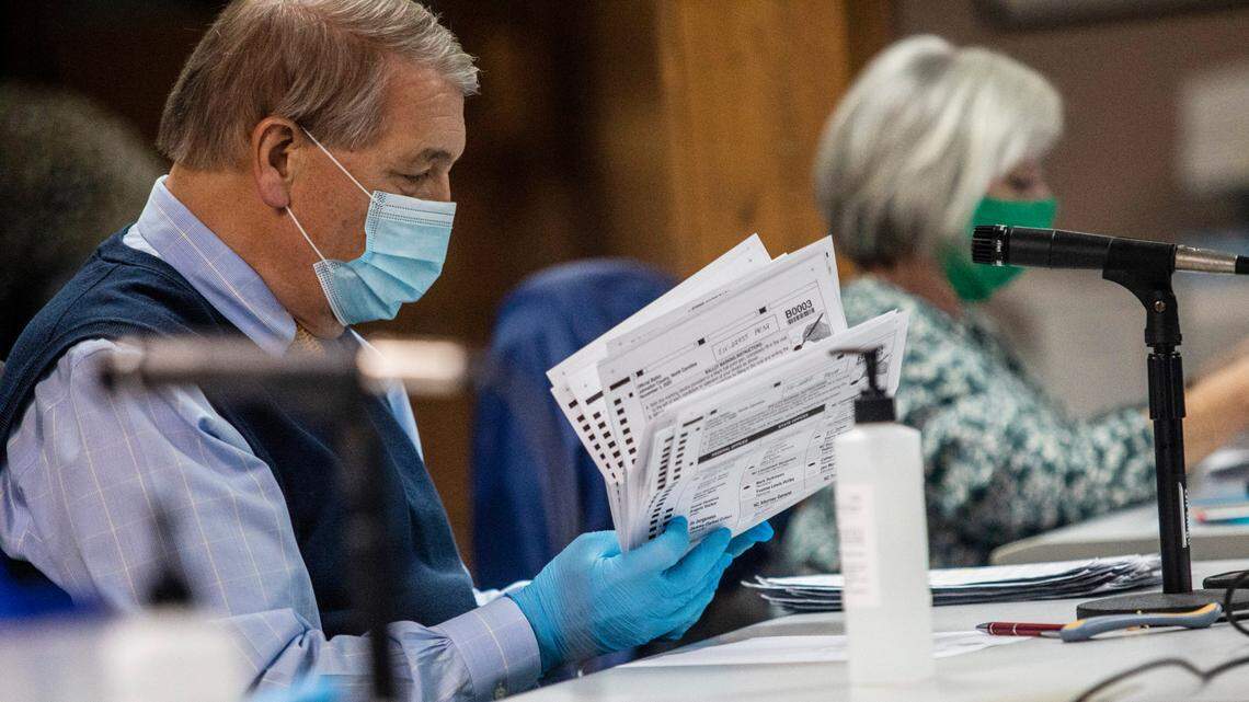 Johnston County Board of Elections members process absentee ballots Monday, Nov. 9, 2020 at the Johnston County Board of Elections satellite office in Smithfield. The board counted absentee, cured, and military ballots.