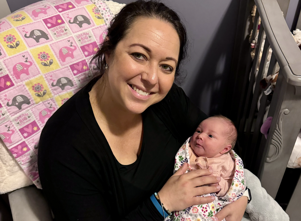 Christina Buchanan and her newborn, Caelah, at home in Apex this week.