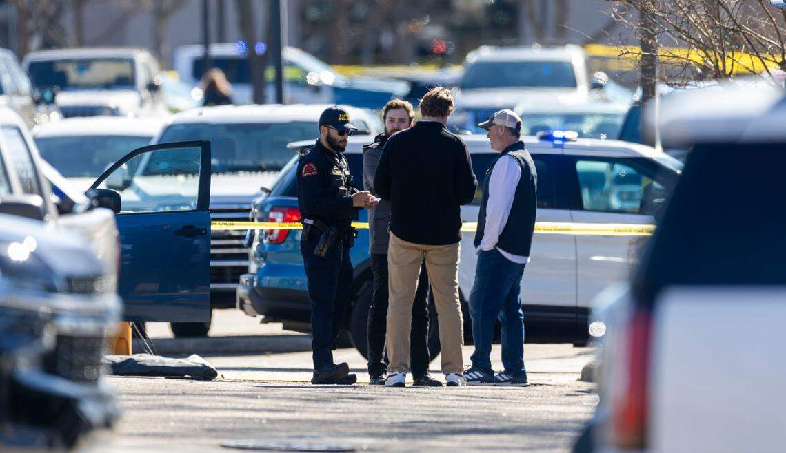 Raleigh Police interview people in the parking lot at N. Hills as they investigate as shooting on Friday, January 17, 2025 in Raleigh, N.C.