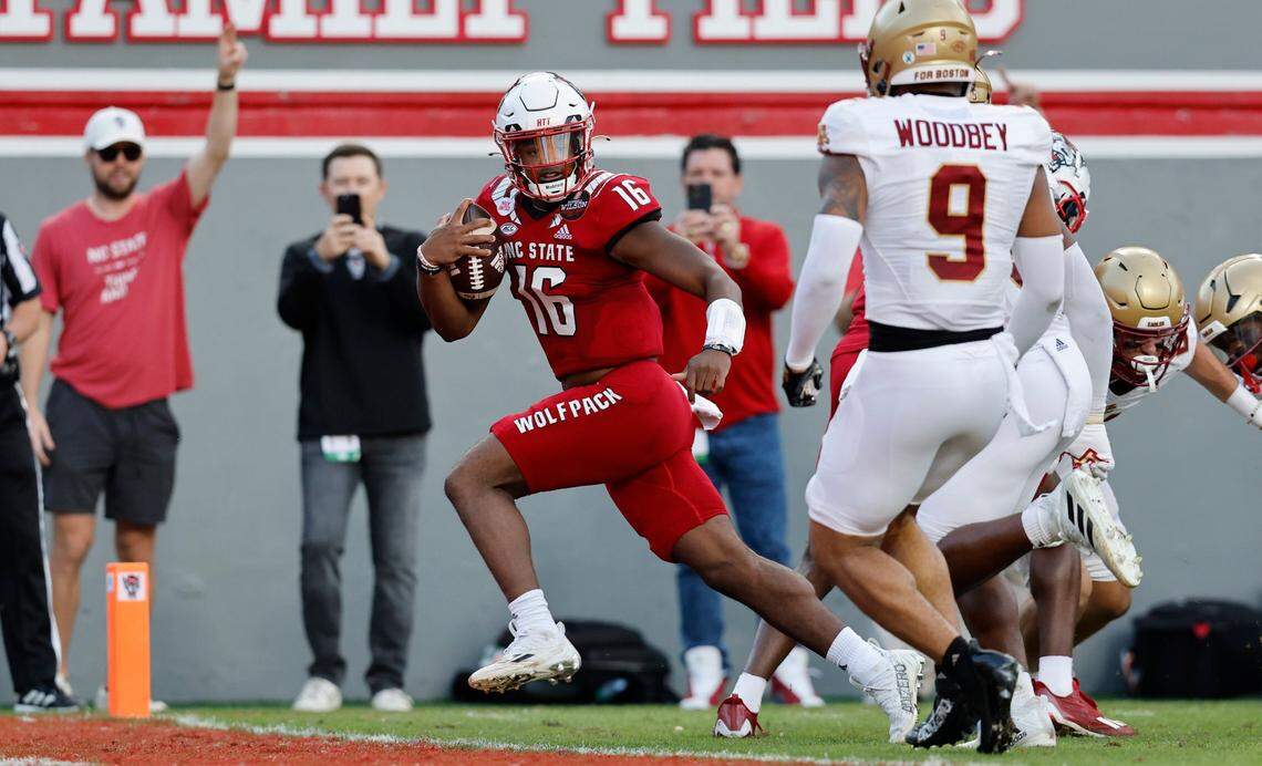 N.C. State quarterback MJ Morris (16) scores on a 10-yard touchdown run during the first half of N.C. State’s game against Boston College at Carter-Finley Stadium in Raleigh, N.C., Saturday, Nov. 12, 2022.