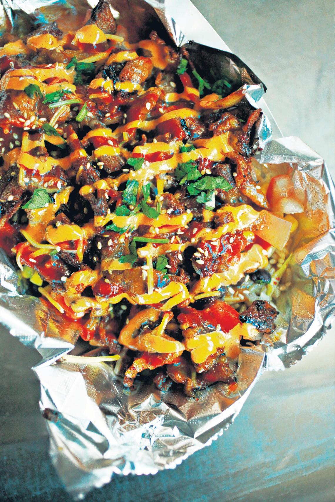 Bulkogi, a Korean BBQ food truck, offers a distinctive menu that’s consistently well-prepared and served in generous portions at affordable prices. Among the offerings is a burrito bowl.