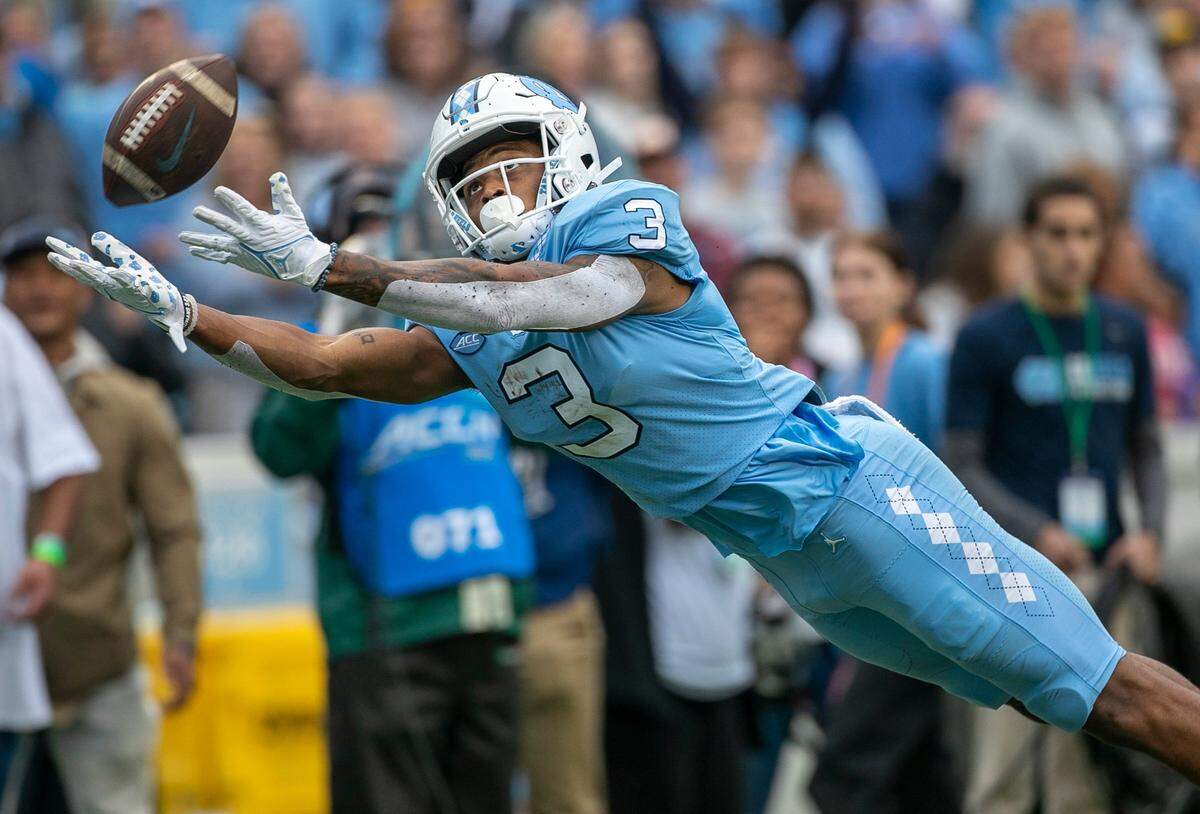 North Carolina’s Antonie Green (3) stretches, but can’t pull in a long pass from quarterback Drake Maye in the first quarter against Virginia Tech on Saturday, October 1, 2022 at Kenan Stadium in Chapel Hill, N.C.