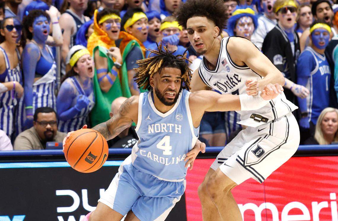 North Carolina’s RJ Davis (4) gets around Duke’s Tyrese Proctor (5) during the first half of Duke’s game against UNC at Cameron Indoor Stadium in Durham, N.C., Saturday, Feb. 1, 2025.