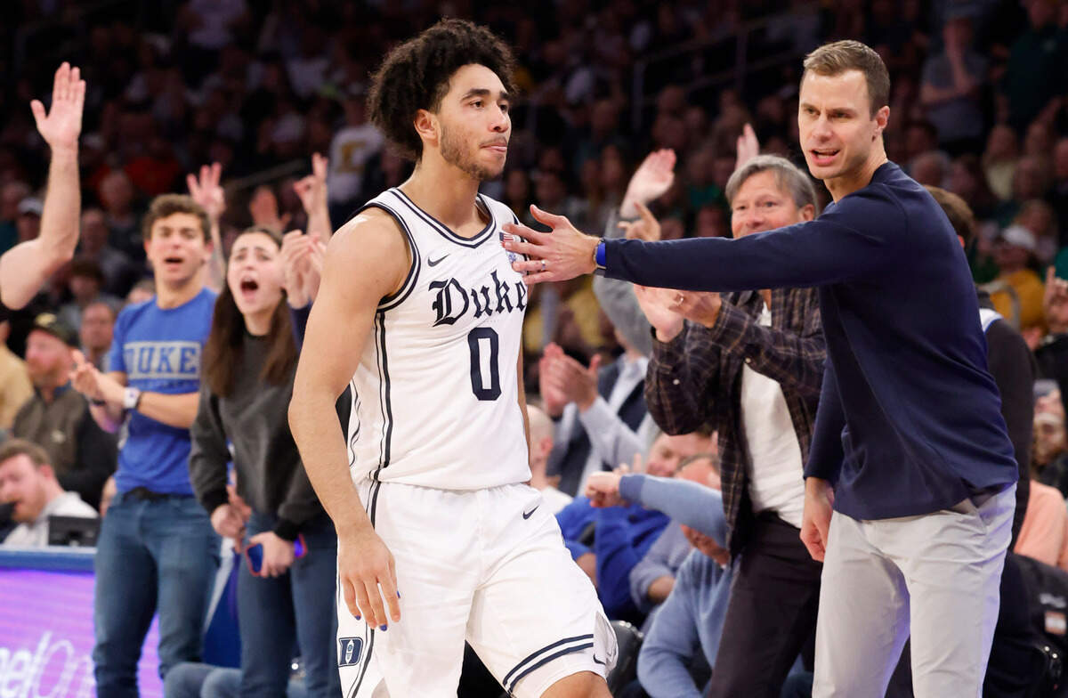 Duke head coach Jon Scheyer congratulates Jared McCain (0) after he hit a three-pointer during the second half of Duke’s 78-70 victory over Baylor at Madison Square Garden in New York City Wednesday, Dec. 20, 2023.