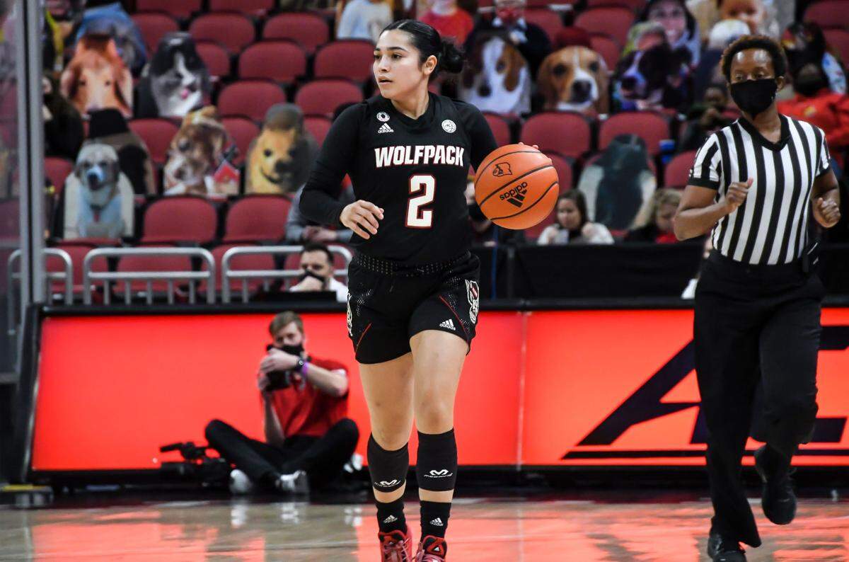 N.C. State’s Raina Perez (2) brings the ball up court during the Wolfpack’s game against Louisville at KFC Yum! Center in Louisville, Ky. Monday, February 1, 2021.