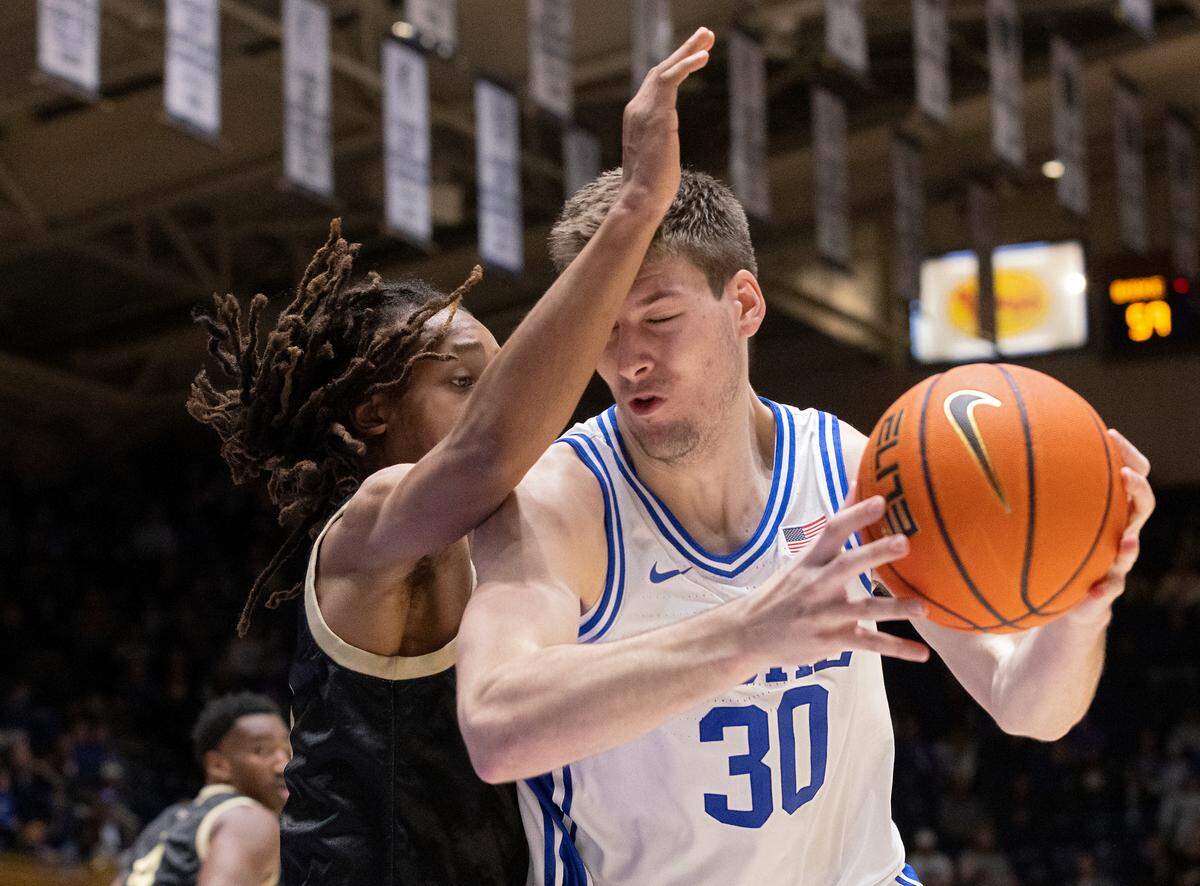 Duke’s Kyle Filipowski drives baseline against UNC Pembroke’s Bradlee Haskell during the second half of the Blue Devils’ 109-64 exhibition win on Wednesday, Nov. 1, 2023, at Cameron Indoor Stadium in Durham, N.C.