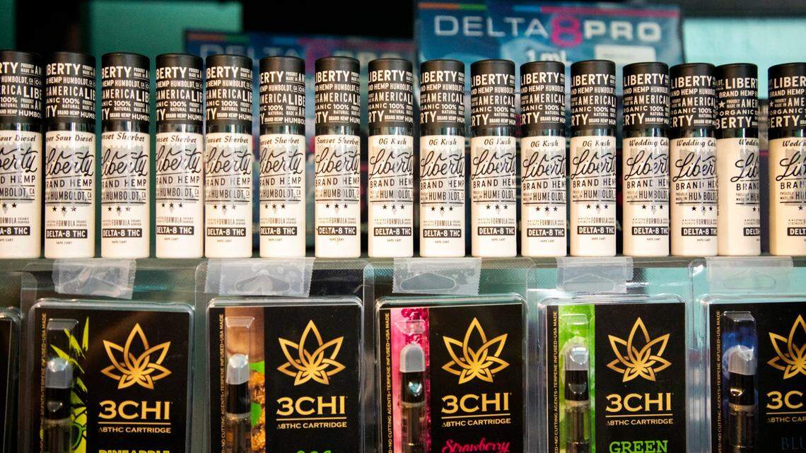 Vape cartridges of Delta 8 THC are displayed on shelves behind the counter in Cannabliss Dispensary, on Wednesday, July 7, 2021, in Chapel Hill, N.C.