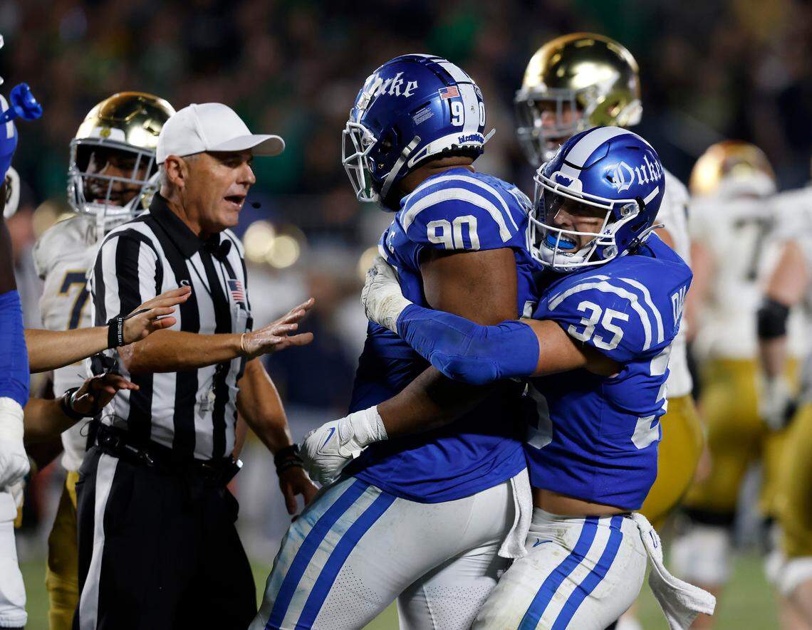 Cam Dillon holds back DeWayne Carter (90) following a play during the second half of the Blue Devils’ 21-14 loss to Notre Dame at Wallace Wade Stadium on Saturday, Sept. 30, 2023, in Durham, N.C.