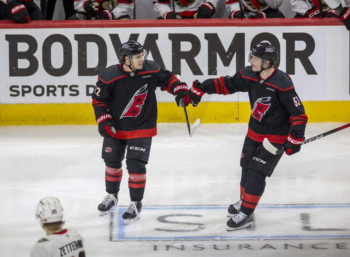 Carolina Hurricanes center Logan Stankoven (22) celebrates with teammate Jackson Blake (53) after scoring to take a 1-0 lead over the Ottawa Senators in the second period on Saturday, April 18, 2026, during the first round of the Stanley Cup playoffs at Lenovo Center in Raleigh, North Carolina.