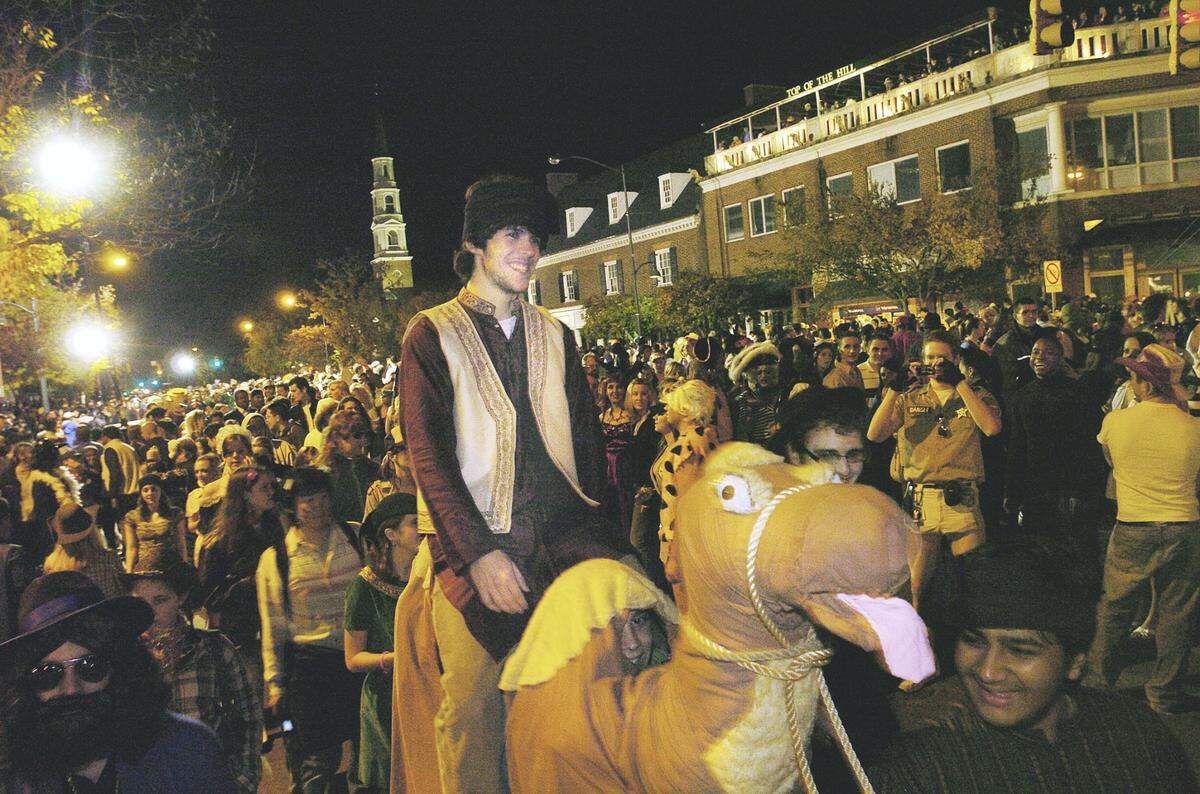 Halloween in Chapel Hill was for years a major celebration with the street closed off to costumed revelers, such as this 2006 night.