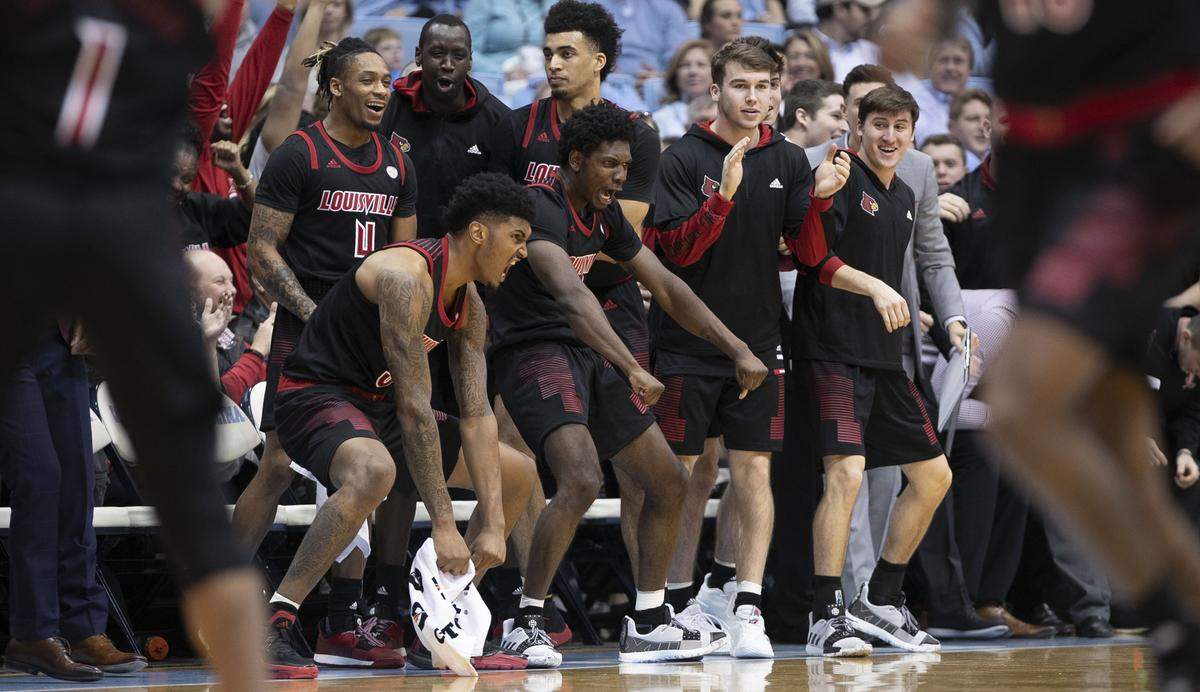 The Louisville bench erupts in celebration after a dunk by Steven Enoch to give the Cardinals’ a 57-43 lead in the second half against North Carolina on Saturday, January 12, 2019 at the Smith Center in Chapel Hill, N.C.