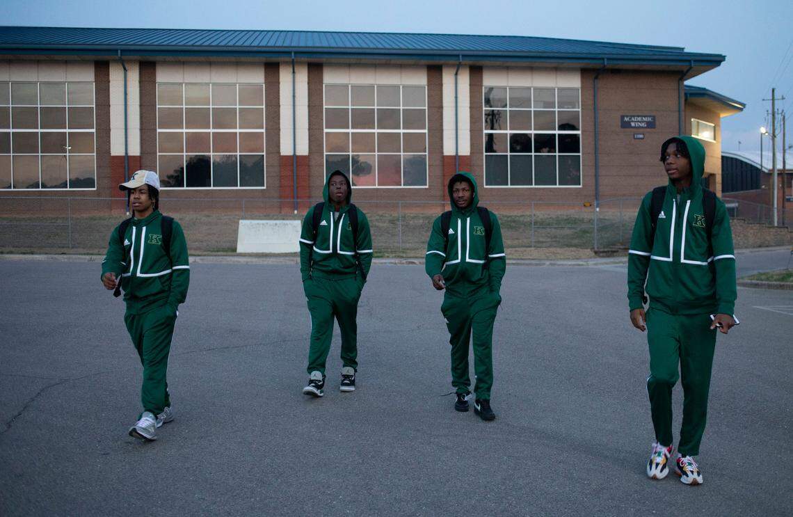 From left, Kinston High School freshman Isaiah Parson, senior Ty’Quez Drake, junior Nizavien Williams, and junior Michael Whitfield walk to their team’s bus in the parking lot at Lee County High School in Sanford, N.C. after an emotional loss to their rival Farmville Central in the 2-A East Regional final game on Saturday, March 5, 2022.