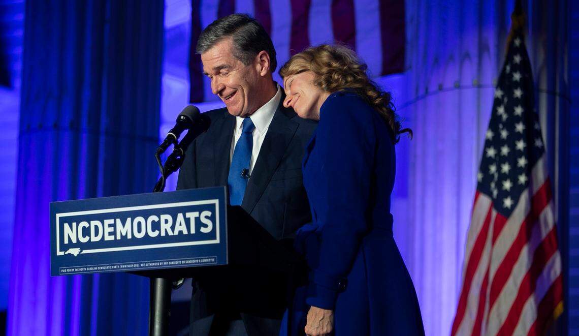 North Carolina Governor Roy Cooper thanks his wife Kristin Cooper as he declares victory at the North Carolina Democratic Party Headquarters to declare victory on Tuesday, November 3, 2020 in Raleigh, N.C.