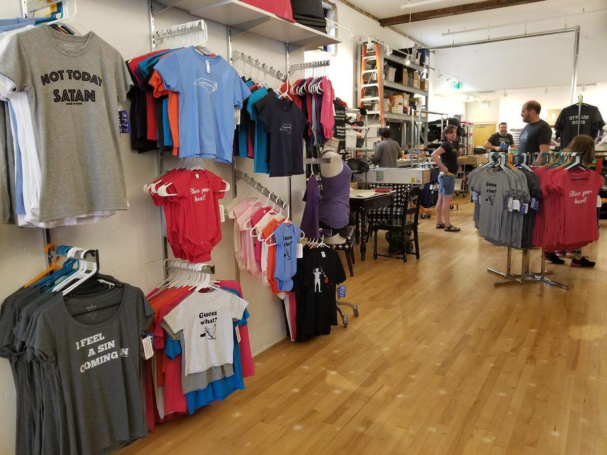 Customers look at clothes in the House of Swank storefront in downtown Raleigh on Sept. 27, 2018.
