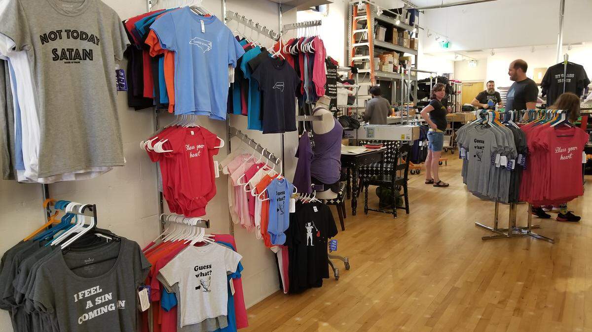Customers look at clothes in the House of Swank storefront in downtown Raleigh on Sept. 27, 2018.