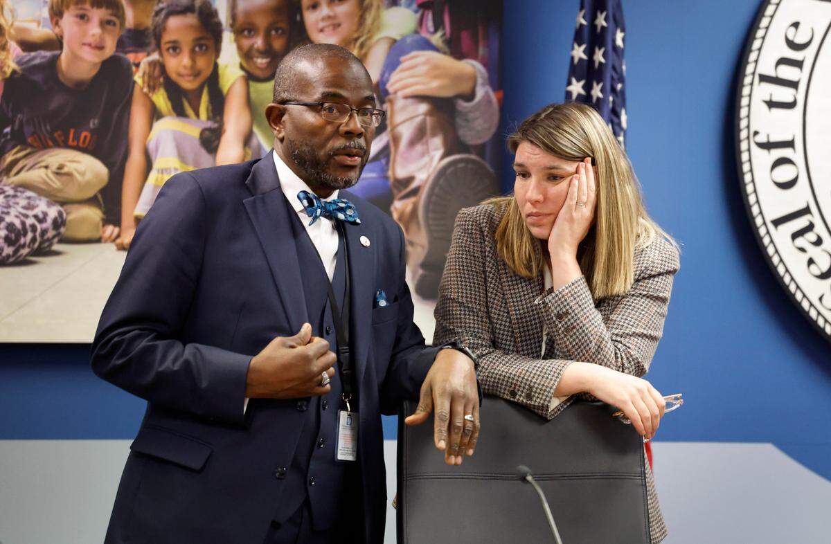 Wake County School Board chair Lindsay Mahaffey, right, talks with Superintendent Robert Taylor after the Wake County School Board Safety and Security meeting broke to go into closed session Tuesday, Nov. 28, 2023. The board will discuss in closed session the deadly fight at Southeast Raleigh High School Monday.