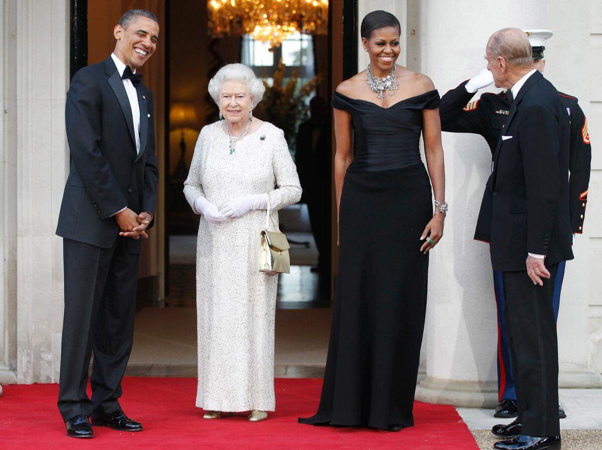 In this May 25, 2011, file photo, President Barack Obama and first lady Michelle Obama welcome Britain’s Queen Elizabeth II and Prince Philip for a reciprocal dinner at Winfield House in London.