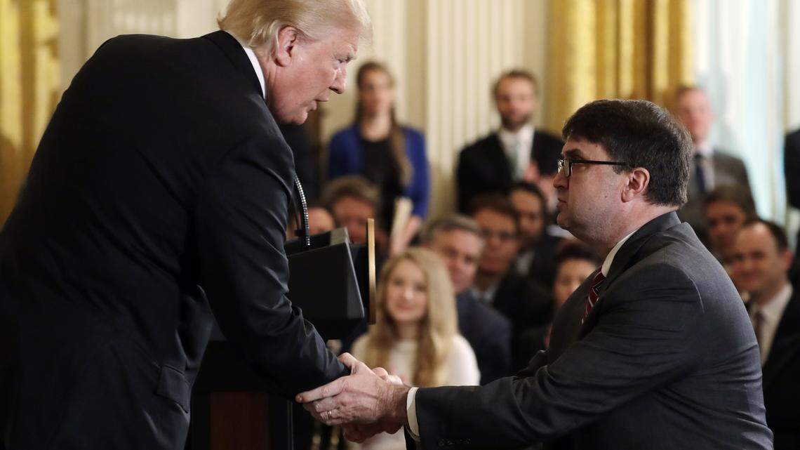 President Donald Trump shakes hands with Acting Veterans Affairs Secretary Robert Wilkie, during an event on prison reform in the East Room of the White House, Friday, May 18, 2018, in Washington. Trump announced he's nominating Acting Veterans Affairs Secretary Robert Wilkie to lead the agency.