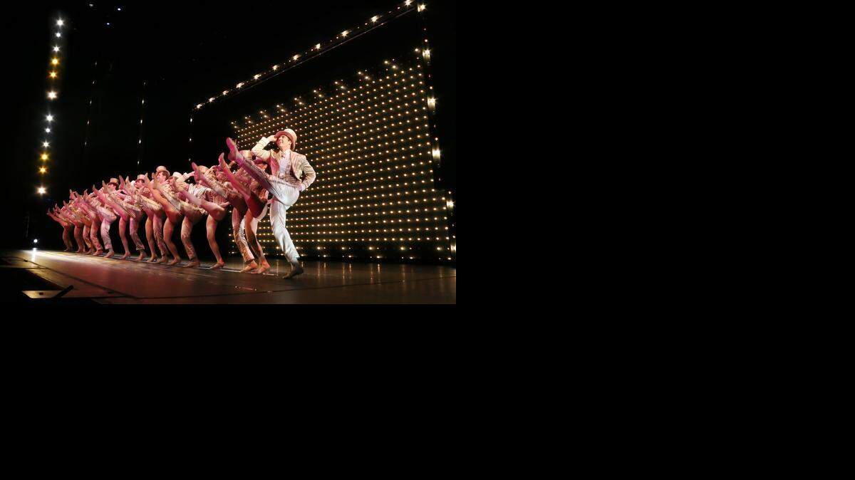 “A Chorus Line” features the famous kickline, the cast in gold lamé and top hats.

