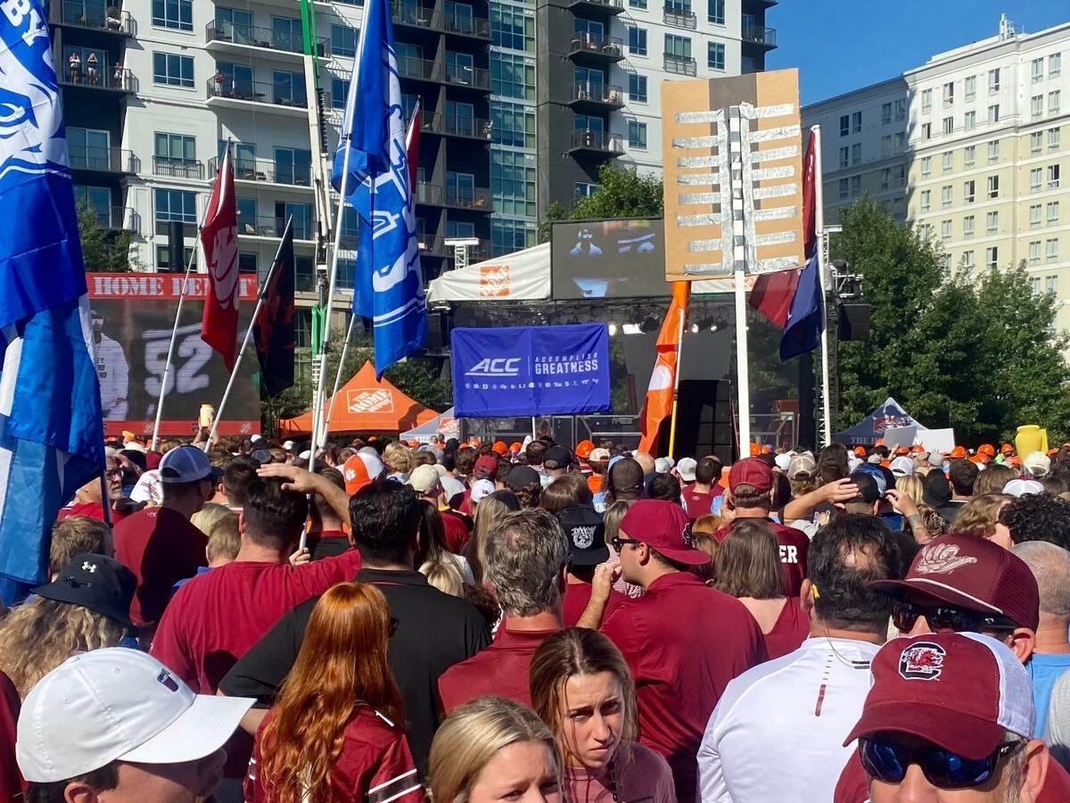 Fans gather to watch ESPN College GameDay on Saturday morning ahead of the Duke’s Mayo Classic, featuring UNC vs. South Carolina, in Charlotte, NC.