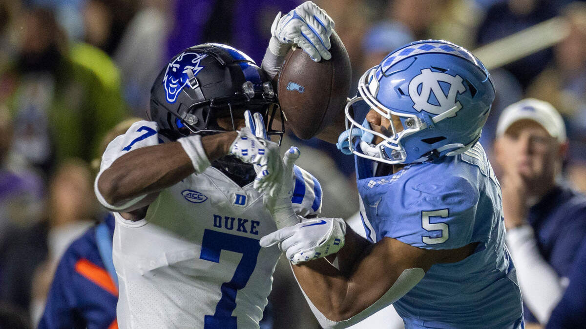 North Carolina’s J.J. Jones (5) picks up 31 yards on a pass completion from quarterback Drake Maye in the second quarter against Duke’s Al Blades Jr. (7) on Saturday, Nov. 11, 2023 at Kenan Stadium in Chapel Hill, N.C.