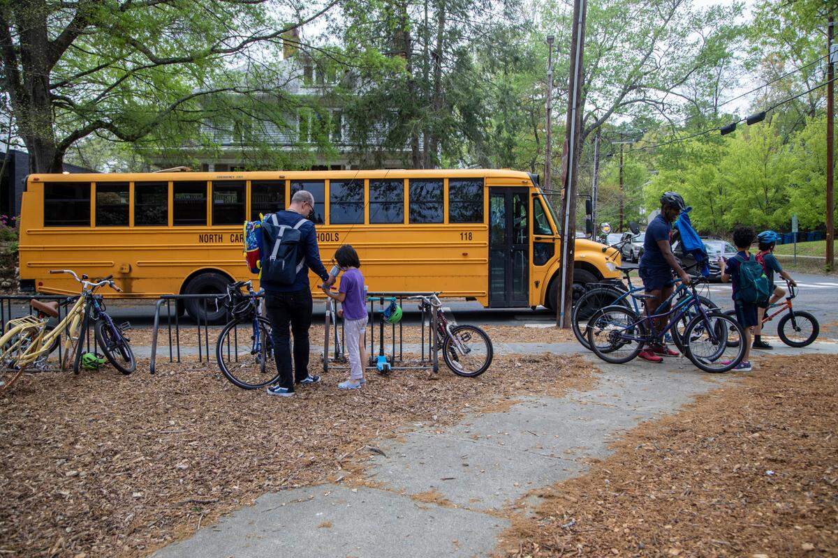 Students are dismissed from George Watts Elementary School in Durham Tuesday, April 12, 2022. Durham’s public school system will begin using a new model for assigning students to schools in the 2023-24 school year, in an attempt to increase equity.