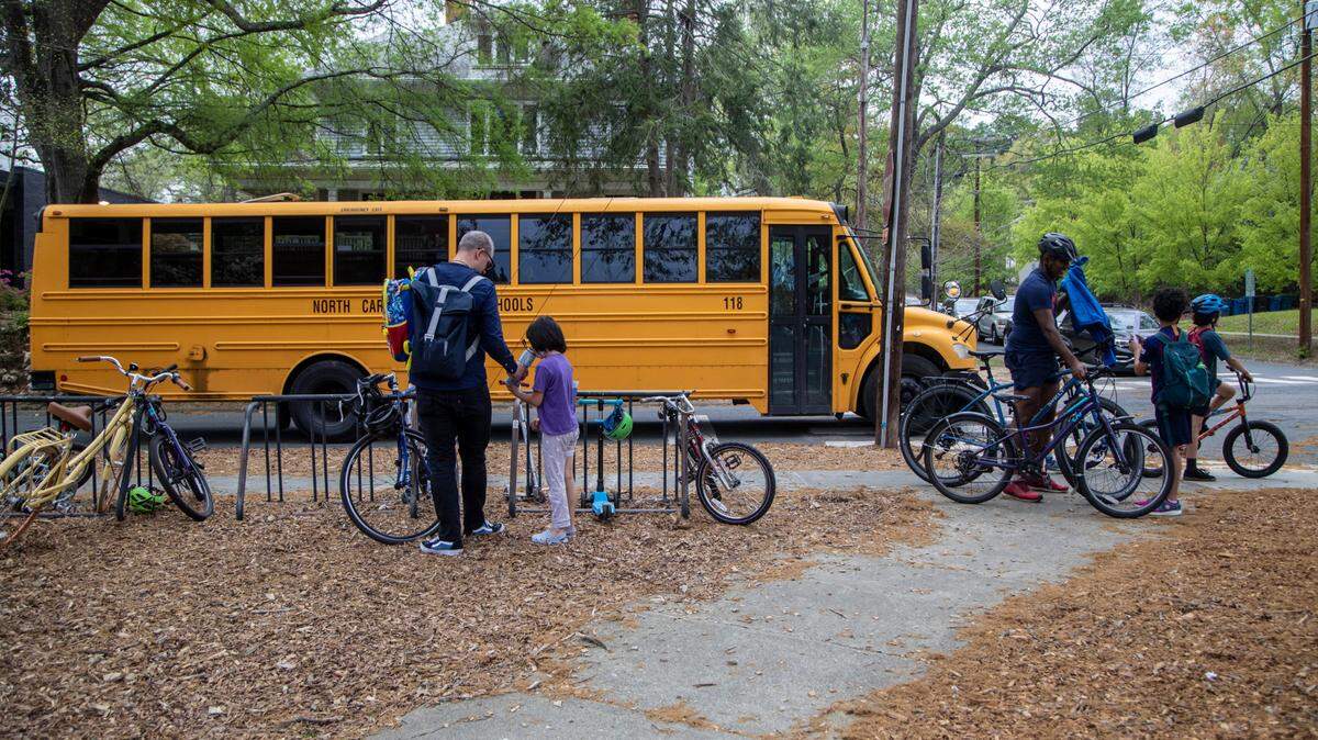 Students are dismissed from George Watts Elementary School in Durham Tuesday, April 12, 2022.