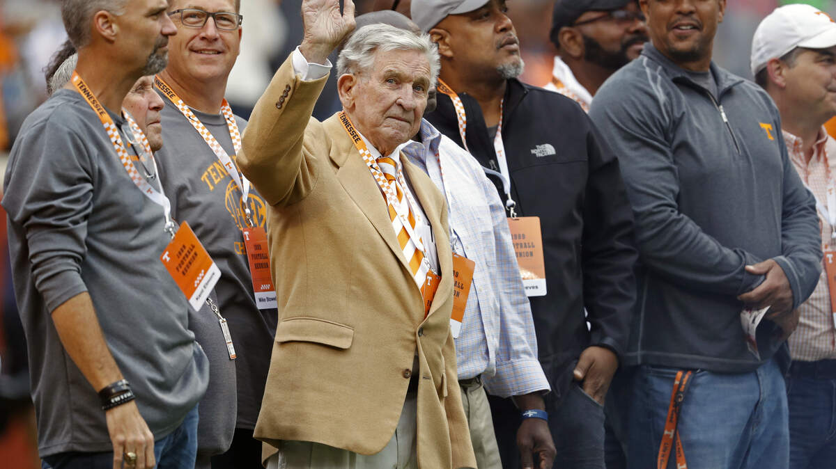 FILE - In this Oct. 12, 2019, file photo, former Tennessee head football coach Johnny Majors waves to fans as he and members of the 1998 football team are introduced in the first half of an NCAA college football game against Mississippi State, in Knoxville, Tenn. Majors, the coach of Pittsburgh’s 1976 national championship team and a former coach and star player at Tennessee, has died. He was 85. Majors died Wednesday morning, June 3, 2020, at home in Knoxville, Tenn., according to a statement from his wife, Mary Lynn Majors. (AP Photo/Wade Payne, FIle)