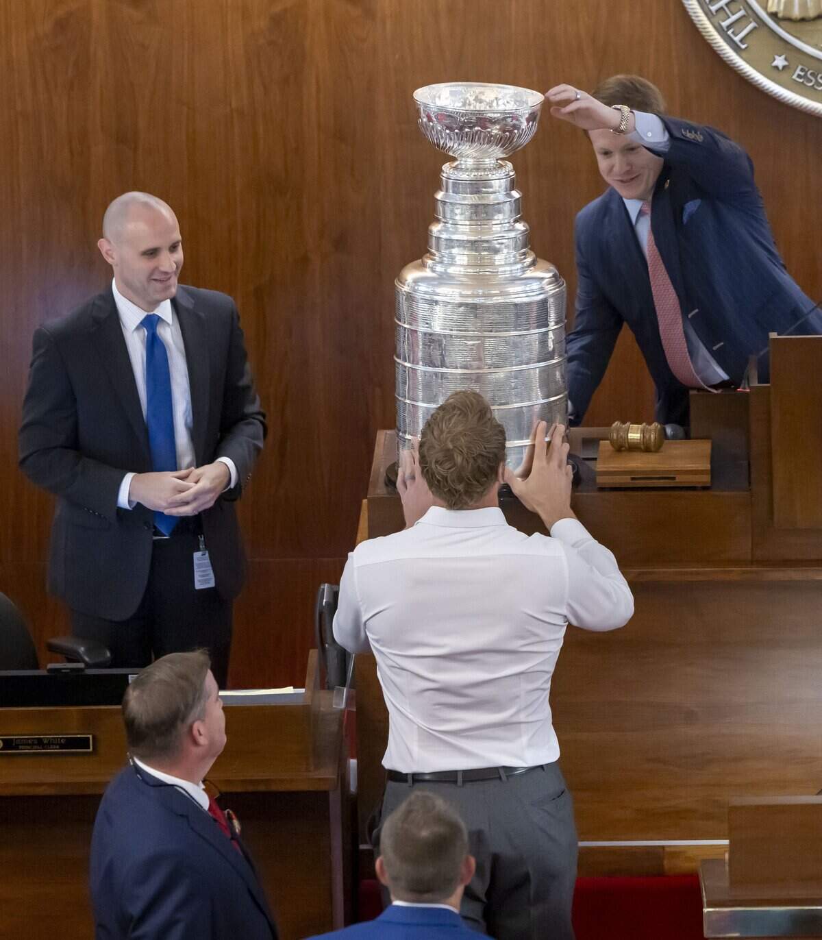 House Speaker Destin Hall helps Carolina Hurricanes captain Jordan Staal position the Stanley Cup on the dais in the House on Tuesday, June 23, 2026 at the General Assembly in Raleigh, NC.