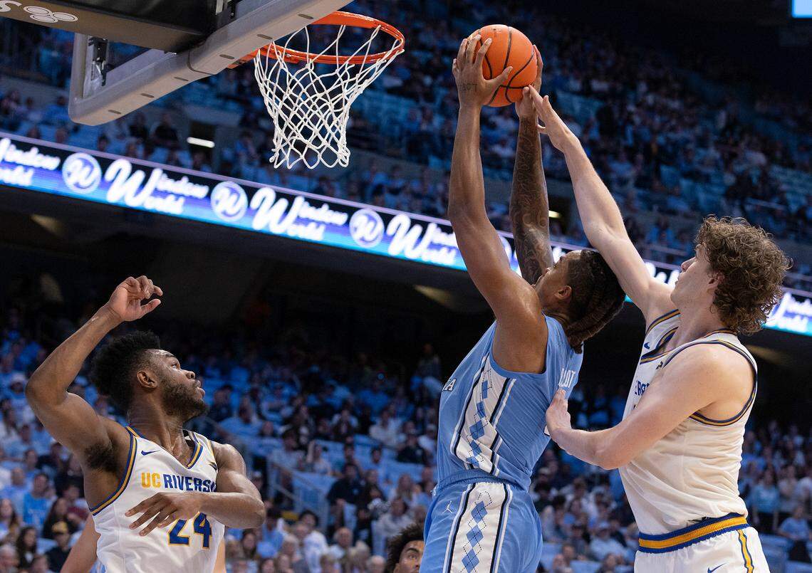 North Carolina’s Armando Bacot powers past UC Riverside’s Benjamin Griscti (1) for a dunk during the second half of the Tar Heels’ 77-52 win on Friday, Nov. 17, 2023, at the Smith Center in Chapel Hill, N.C.
