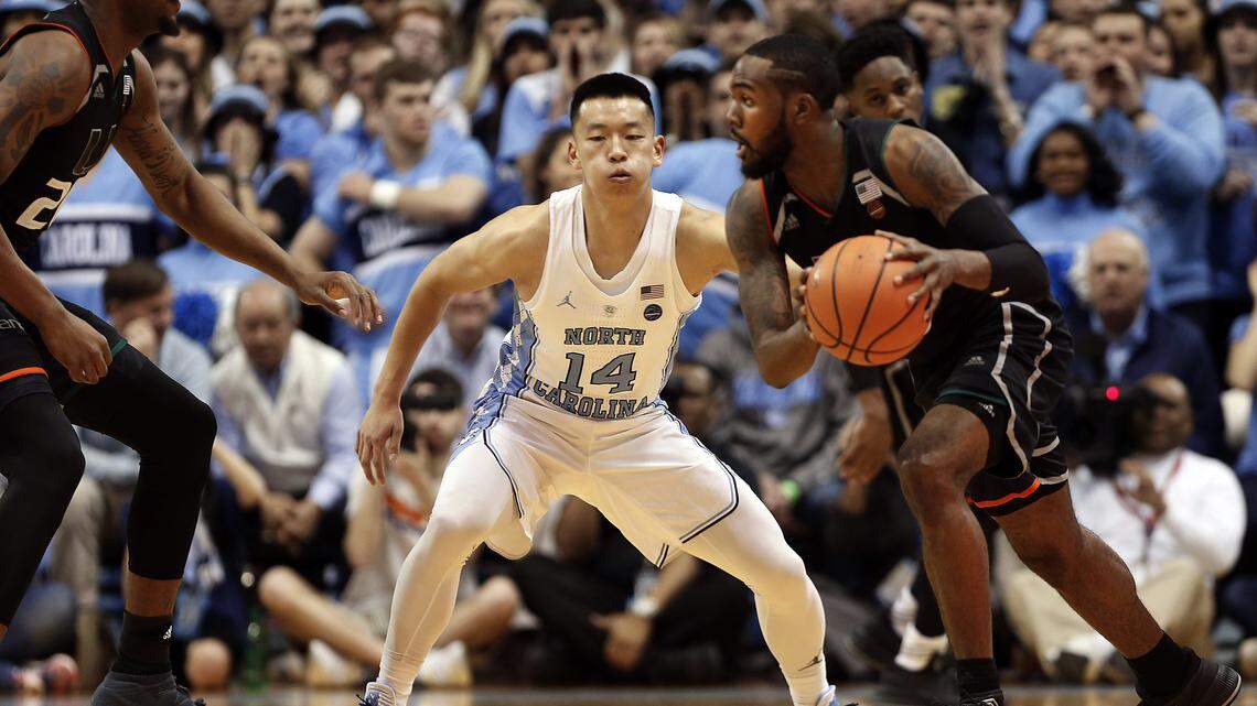 North Carolina senior walk-on Kane Ma (14) plays defense against Miami in February 2019. Ma spent three seasons on UNC’ JV team before being called up to varsity in December 2018.