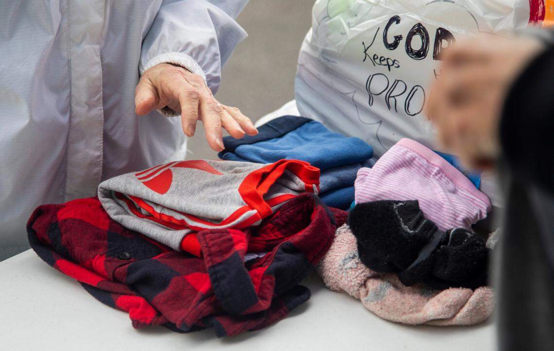 Volunteers with a N.C. Baptists&nbsp;on Mission&nbsp;disaster relief crew fold laundry for people effected by power outages in Moore County Tuesday, Dec. 6, 2022 at the First Baptist Church of Pinehurst . Two deliberate attacks on electrical substations in Moore County Saturday evening caused days-long power outages for tens of thousands of customers.