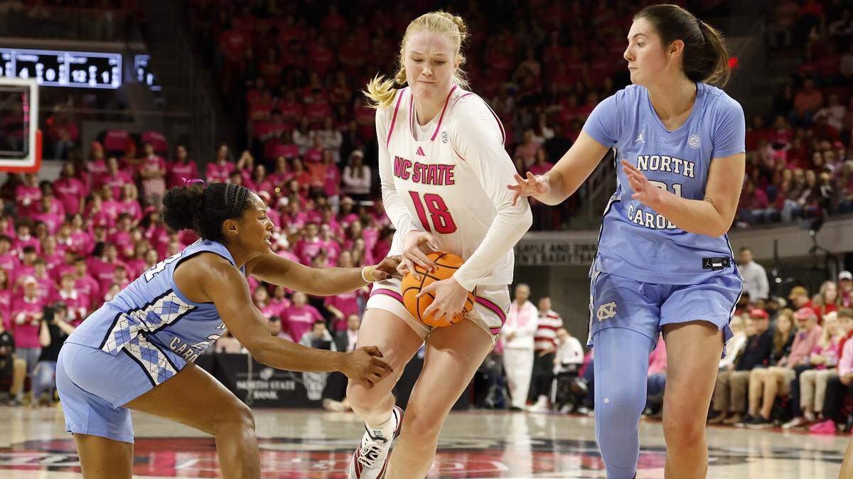 N.C. State’s Tilda Trygger drives between North Carolina’s Indya Nivar and Ciera Toomey during the second half of the Wolfpack’s 61-59 loss on Monday, Feb. 2, 2026, at Reynolds Coliseum in Raleigh, N.C.