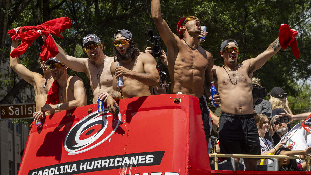 Carolina Hurricanes players celebrate on top of a bus during a parade and rally celebrating their Stanley Cup Final victory over the Vegas Golden Knights. The Hurricanes won the series 4-2 to capture the Stanley Cup for the second time since 2006.