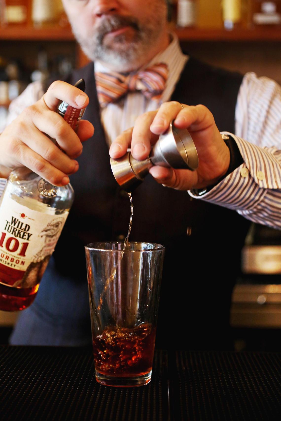 Bartender Shannon Healy prepares the Alley Cocktail made up of Wild Turkey 101 Bourbon, Dry Vermouth, Cynar, Luxardo Maraschino and celery bitters at Alley Twenty Six in Durham.
