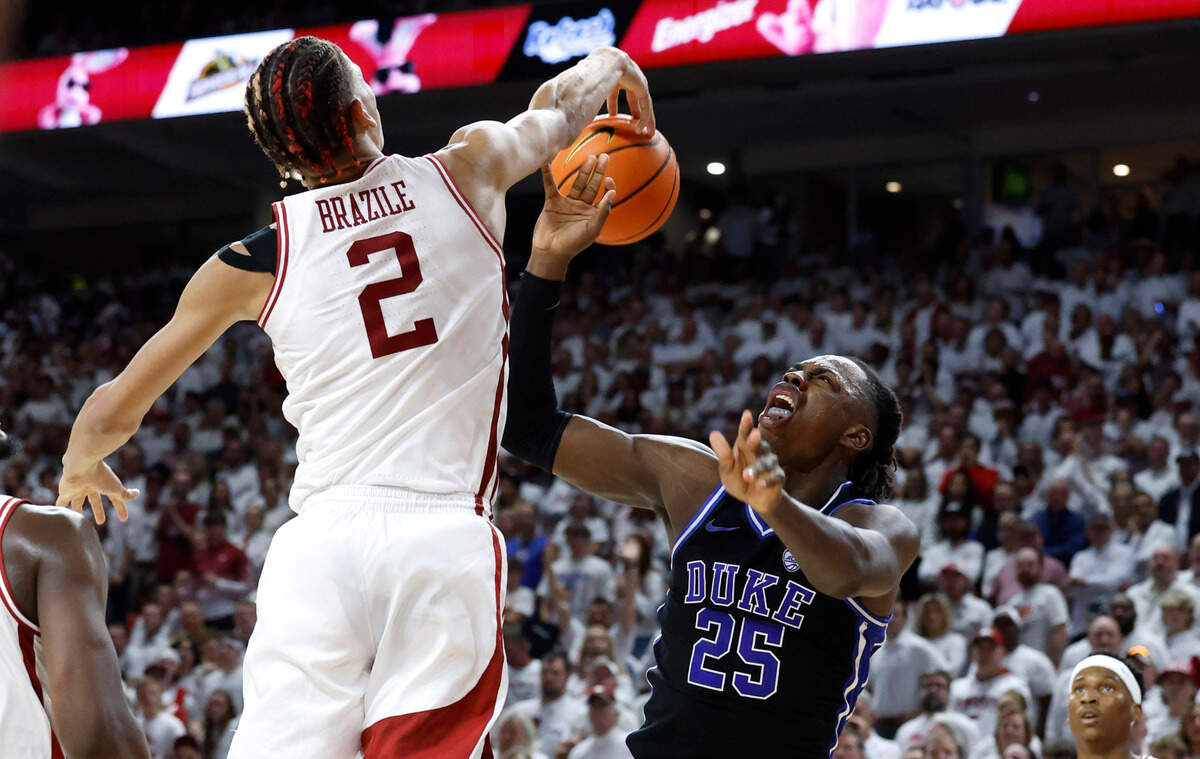 Arkansas’ Trevon Brazile (2) blocks the shot by Duke’s Mark Mitchell (25) during the second half of Arkansas’ 80-75 victory over Duke at Bud Walton Arena in Fayetteville, Ark., Weds. Nov. 29, 2023.