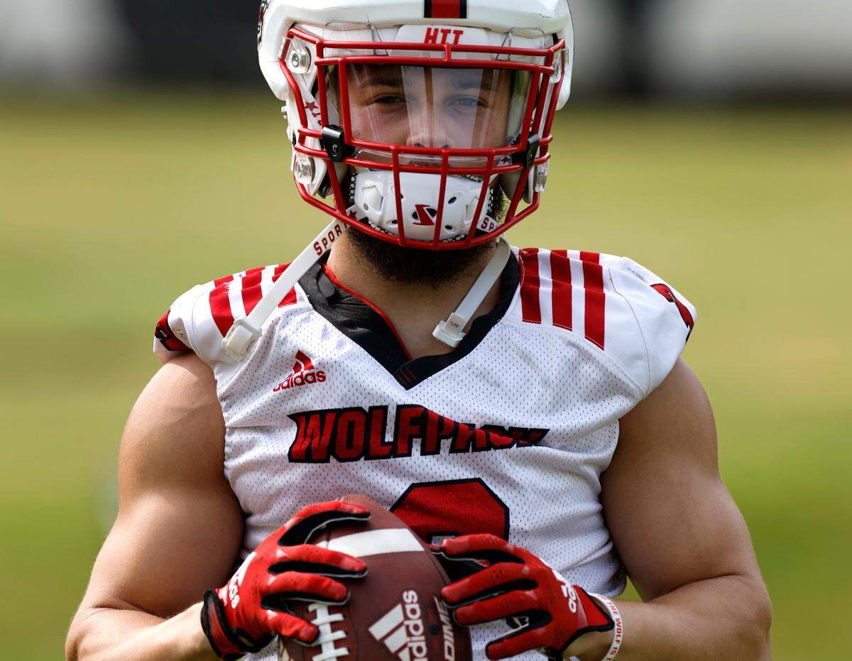 N.C. State running back Jordan Houston (3) waits for a drill to start during the Wolfpack’s first fall practice in Raleigh, N.C., Wednesday, August 2, 2023.