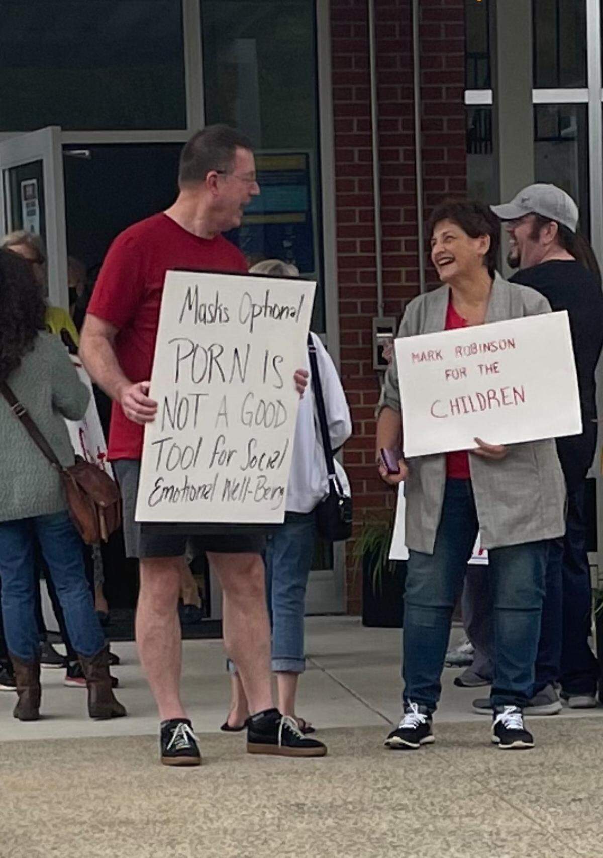 Protesters gather outside an Orange County school board meeting in 2021, as board members consider a resolution opposing “incidents of hostile and racist behavior.”