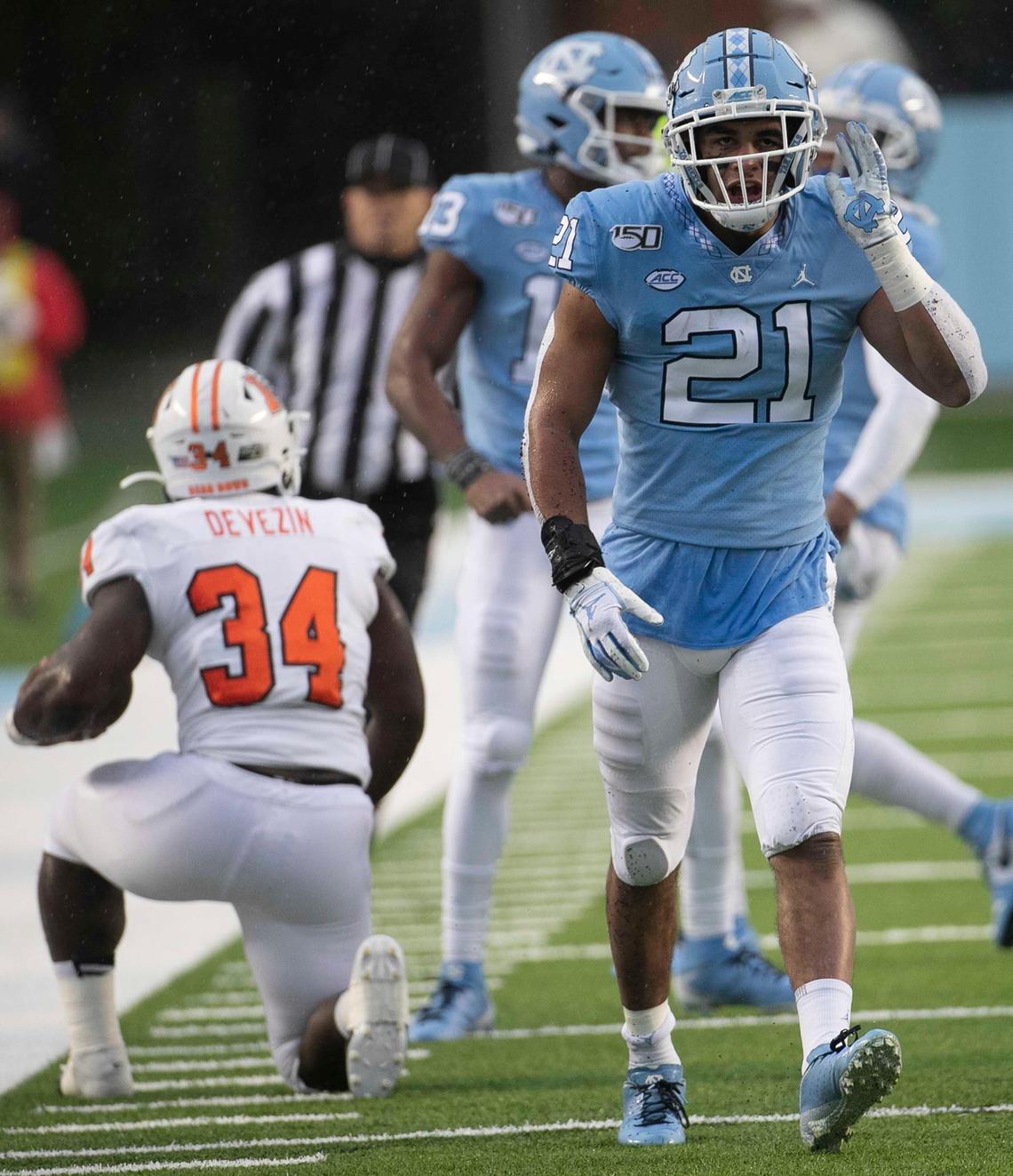 North Carolina’s Chazz Surratt (21) reacts after stopping Mercer’s Tyray Devezin (34) on third down in the first quarter on Saturday, November 23, 2019 at Kenan Stadium in Chapel Hill, N.C.