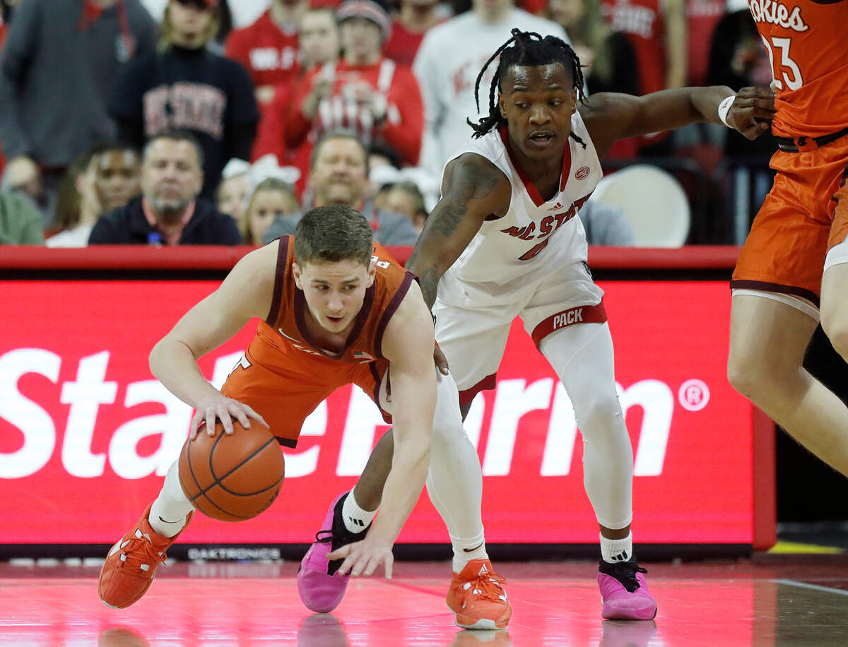 N.C. State’s DJ Horne pressures Virginia Tech’s Sean Pedulla during the second half of the Wolfpack’s 84-78 loss on Saturday, Jan. 20, 2024, at PNC Arena in Raleigh, N.C.