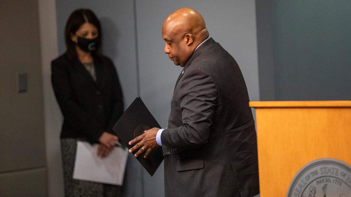 Secretary of the NC Department of Public Safety Erik Hooks leaves the lectern after speaking during briefing on North CarolinaÕs coronavirus pandemic response Tuesday, Jan. 12, 2021 at the NC Emergency Operations Center in Raleigh.