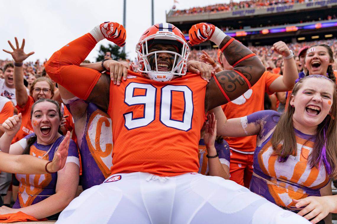 Clemson Tigers defensive tackle Jabriel Robinson (90) pumps up the crowd before an NCAA college football game against the Furman Paladins in Clemson, S.C., Saturday, Sept. 10, 2022.