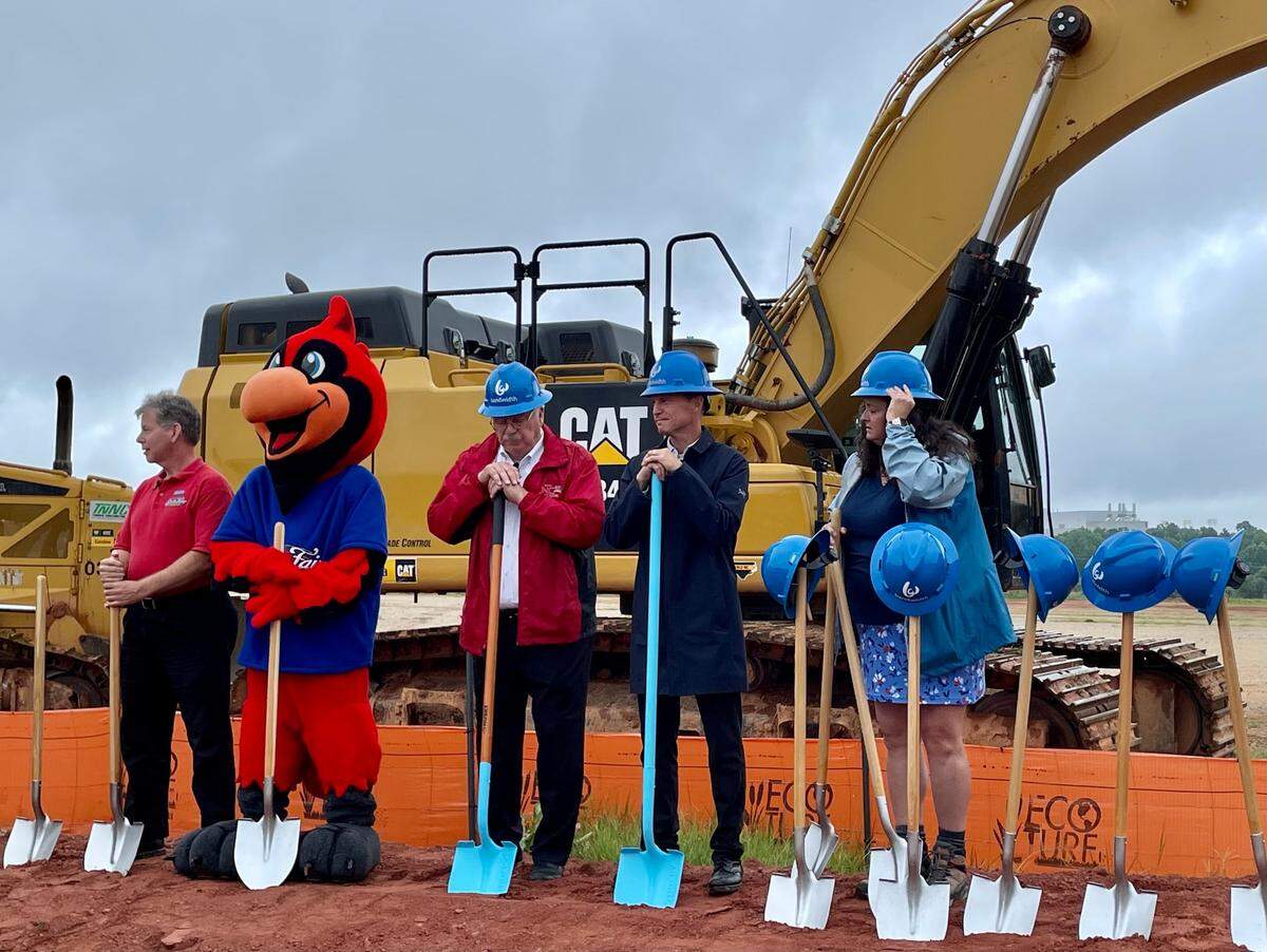 Bandwidth CEO David Morken, second from right, breaks ground on his company’s new headquarters in Raleigh on July 19, 2021.