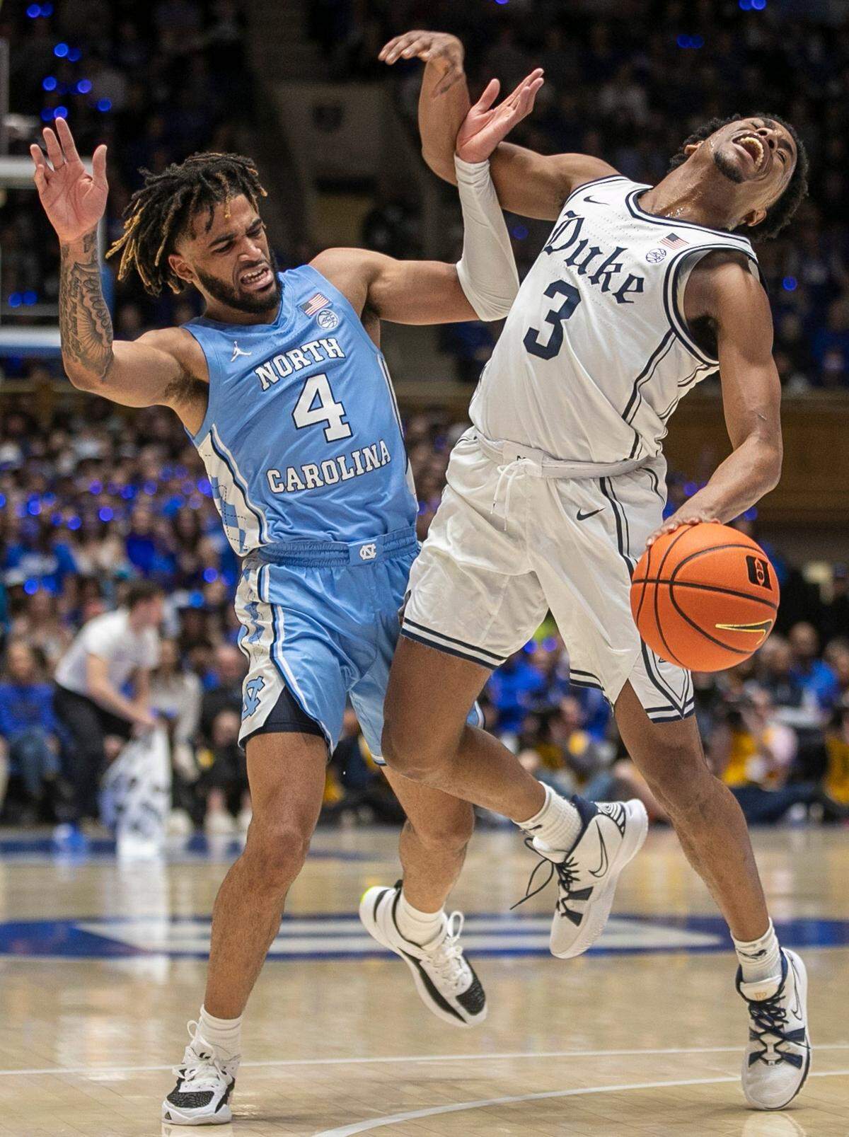 North Carolina’s R.J. Davis (4) is called for a foul against Duke’s Jeremy Roach (3) in the first half on Saturday, February 4, 2023 at Cameron Indoor Stadium in Durham, N.C.