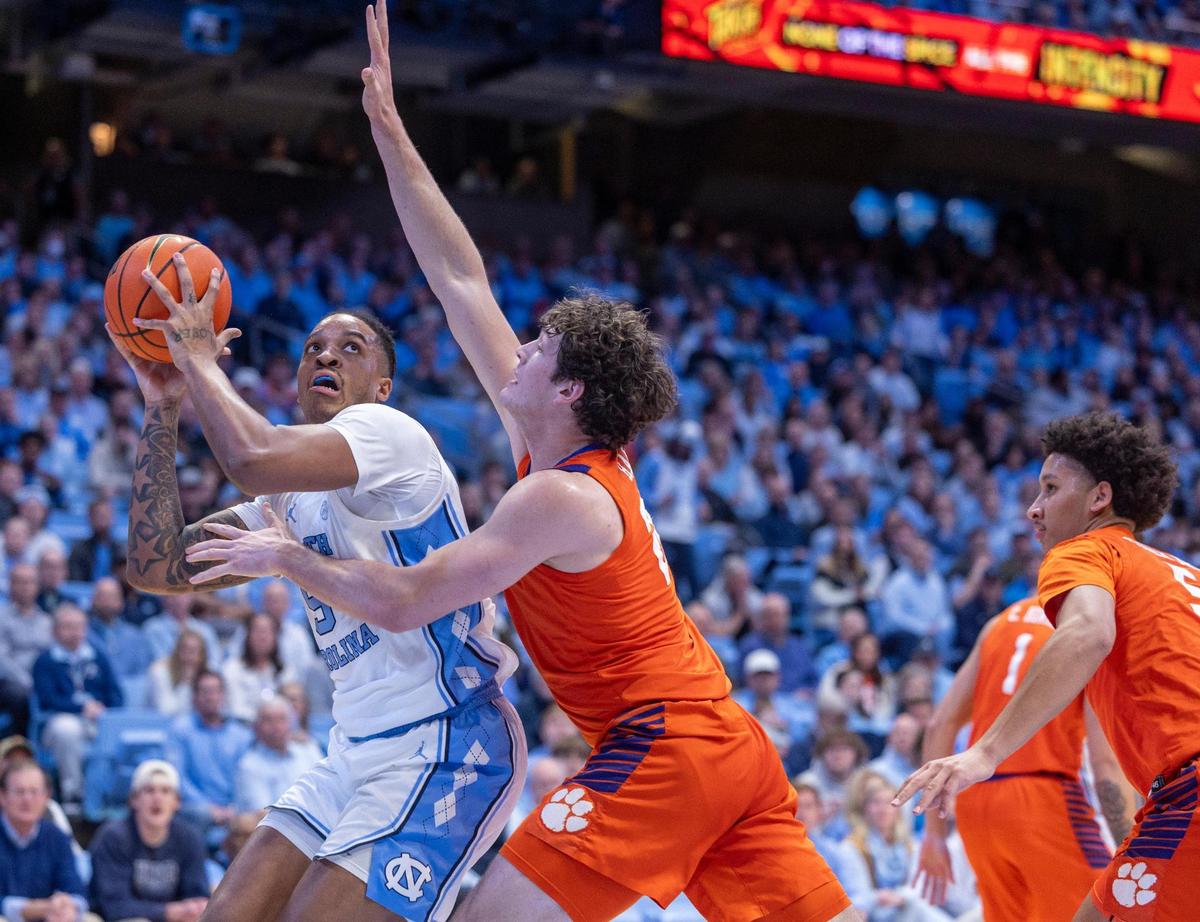 North Carolina’s Armando Bacot (5) muscles his way to the basket against Clemsons P.J. Hall (24) in the first half against North Carolina on Tuesday, February 6, 2024 at the Dean E. Smith Center in Chapel Hill, N.C.
