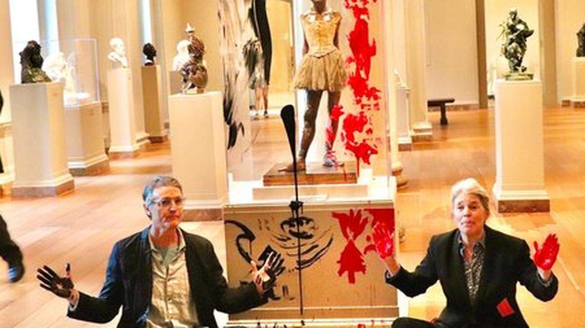 Tim Martin and Joanna Smith after their paint-smearing protest at the National Gallery of Art in Washington, D.C., on behalf of global warming reform.